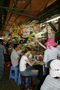 Eating at a stall inside the Chinese Market