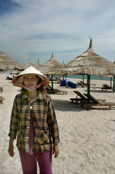 Rent a chair under a thatch-roofed shade umbrella for pennies a day in Nha Trang
