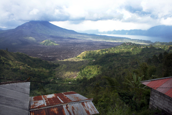 Viewing the lava flow from the distant Kintamani volcano Bali