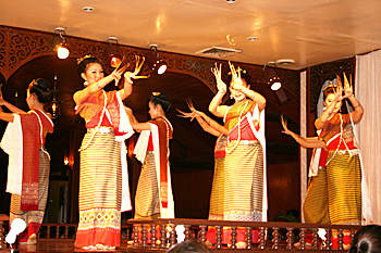 Thai dancers wear long golden fingernails during this traditional dance