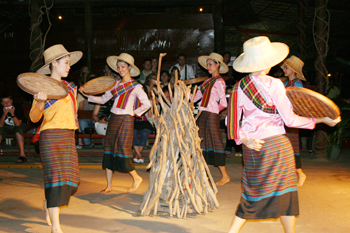 Rice threshing dance performed in Chiang Mai Thailand
