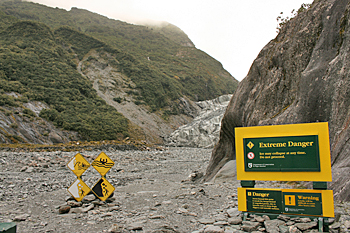 Warning to hikers in the river valley leading to the Franz Josef glacier in New Zealand