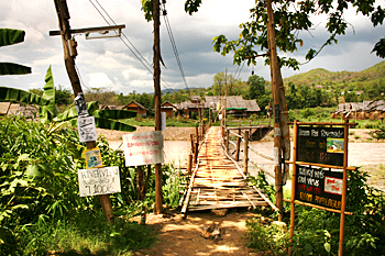 A rickety bamboo bridge crosses the Pai River