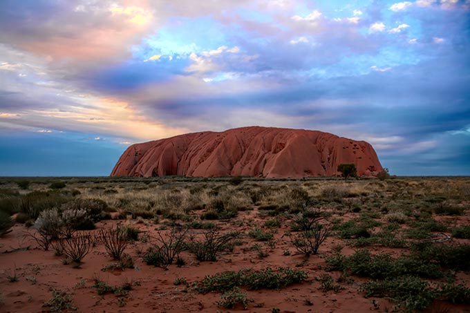 Uluru, located in the Red Center of the continent, is a quintessential image associated with