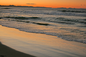 Sunset turns the sky orange Byron Bay Australia