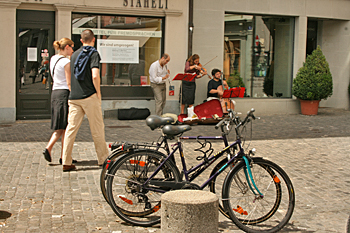 Bicyclists race around the twisting streets of Zurich Switzerland