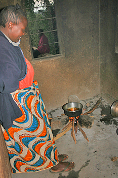 Sara cooks over an open fire in the "kitchen" of her home in Monduli Juu Tanzania