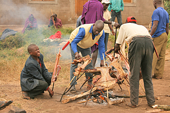 Cooking goat at the Maasai "Red Market" in Monduli Juu Tanzania