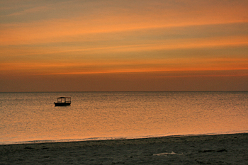 Lone boat remains on Nungwi beach in Zanzibar