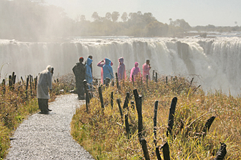 Rain gear is advised when viewing Victoria Falls Zimbabwe