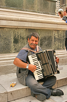 Happy street musician in Florence Italy