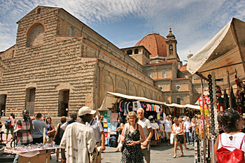 Shopping at the piazza surrounding San Lorenzo Basilica in Florence Italy