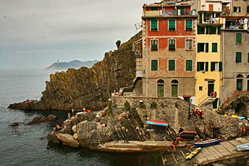 Boats line the street in pretty little Riomaggiore in Cinque Terre Italy