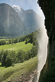 Peeking out from behind the waterfall in Lauterbrunnen Switzerland