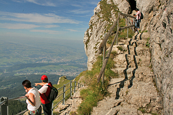 Uneven trail steps atop Mount Pilatus Switzerland hewn from the rock face 