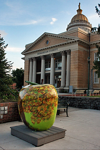 Giant apple decorates sidewalk in front of Hendersn County Courthouse