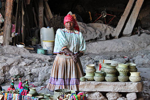 Tarahumara woman poses proudly in her cave home