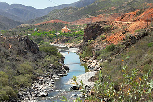 First view of Satevo Mission from within the rugged river valley, deep within Copper Canyon
