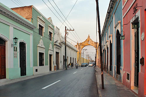Flat-fronted buildings line the streets of the historic district of Merida, Mexico