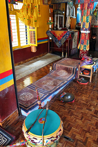 Carpeted platforms were monks sit during puja and daily prayers