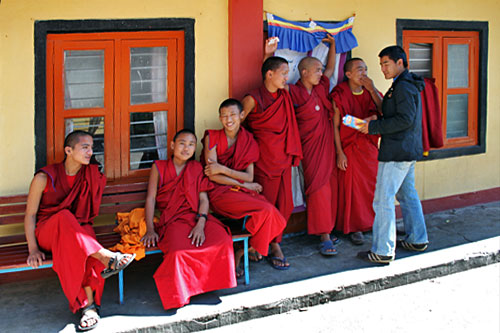 Monks relax at Shree Gaden Dhargay Ling Tibetan Monastery