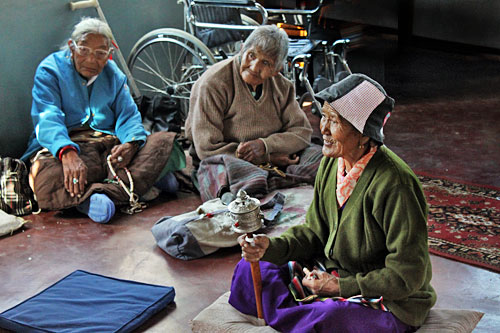 Tibetan women exchange news at International Human Rights Day Celebration at Tashiling Tibetan refugee settlement in Pokhara, Nepal