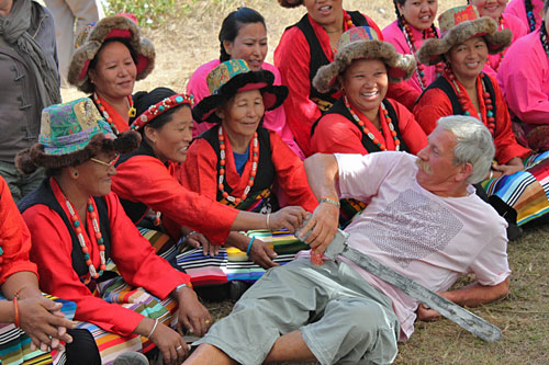 Haming it up with Tibetan ethnic dancers at Jampaling Tibetan Refugee Settlement