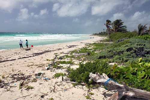 Trash on beach in southern Yucatan, Mexico