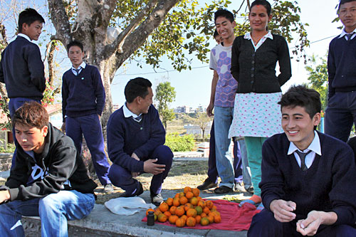 Nepali kids convince me to throw orange peels in field for recycling