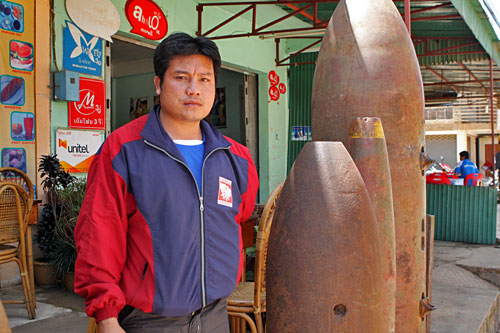 Bounmy Vichack lost left arm when UXO exploded while digging fish pond on his family farm