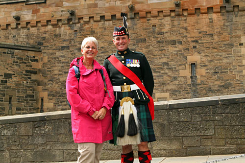 Posing with a member of the Scottish Guard in front of Edinburgh Castle