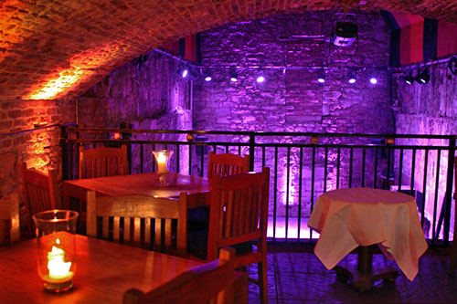 A restored cavern at The Caves, a bar carved out of the ancient vaults and passageways discovered beneath the Old City in Edinburgh, Scotland