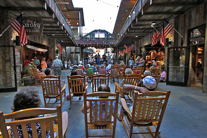 Visitors Grab a Rocking Chair to Listen to Free Music in Gatlinburg, Tennessee