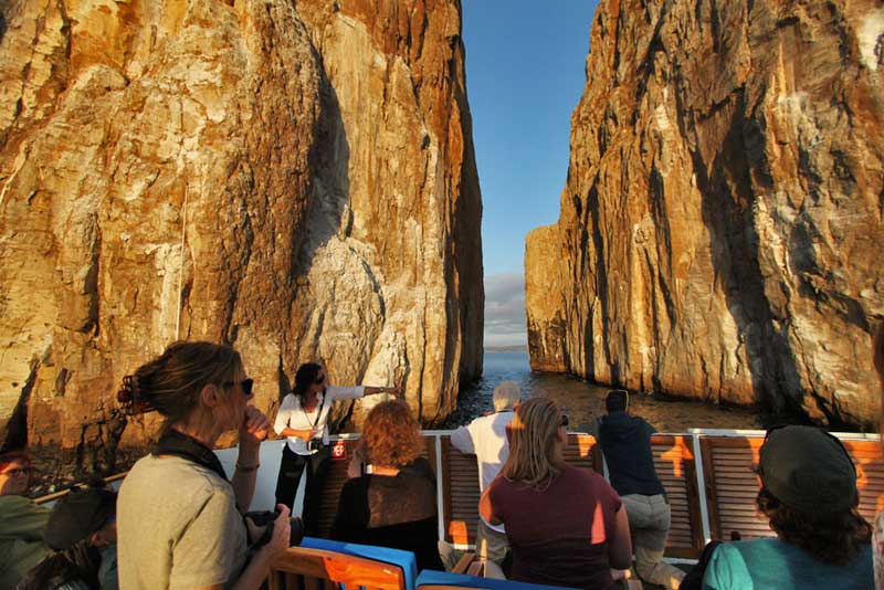 At Sunset, Captain Pulls Boat Up to Split in Kicker Rock, Near San Cristobal, in the Galapagos Islands of Ecuador