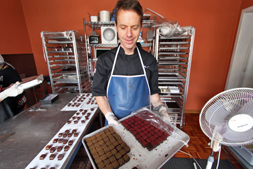 Chocolatier Jeffrey Stern displays trays of handmade bonbons