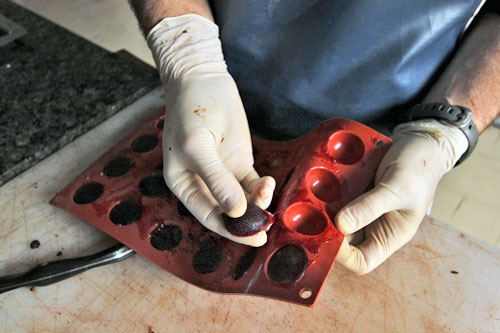 Peeling the Mora jelly filling out of plastic molds