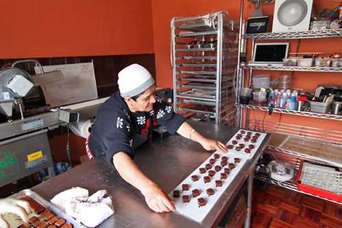 Finished bonbons are set out to dry