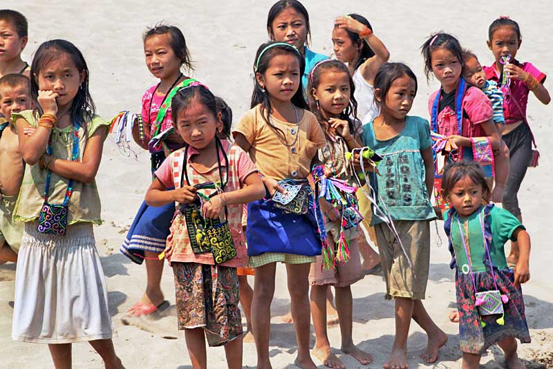 Hill Tribe Children Meet Our Boat During a Cruise Down the Mekong River in Laos