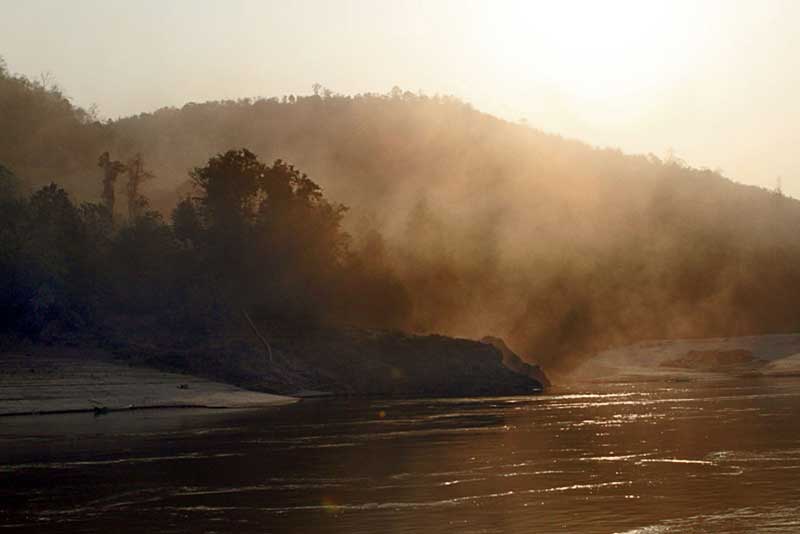 Mists Blanket the Mekong River at Sunrise in Northern Laos
