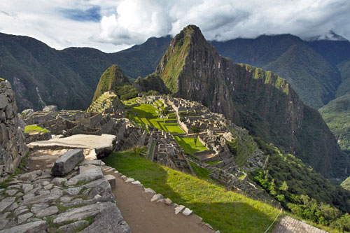 Late afternoon view of Machu Picchu Citadel as clouds part and sun breaks through