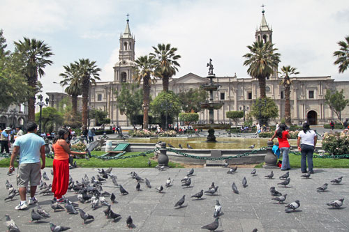 The Basilica Cathedral, built of pearly white volcanic rock that gave Arequipa its nickname of the "White City," is backdrop for the central Plaza de Armas, where pigeons roam by the thousands
