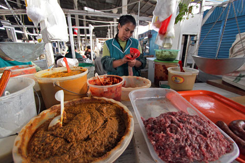 Spicy, spicier, and spiciest sausages made fresh at the San Pedro Market in Cusco