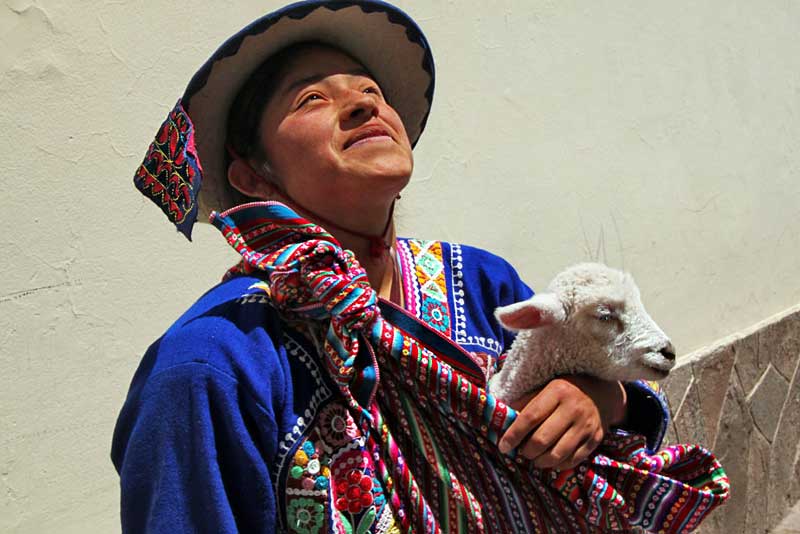 Quichua Woman With Baby Sheep in Cusco, Peru
