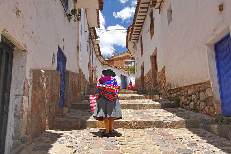 Quichua Woman Slowly Makes Her Way Up Steep Narrow Streets in the San Blas Neighborhood of Cusco, Peru
