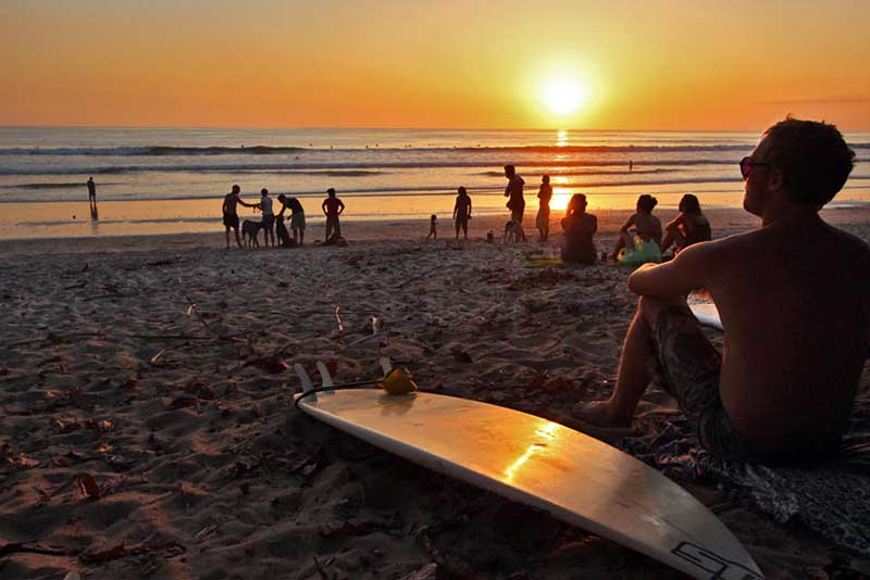 Surfers Watch the Sunset on Santa Teresa Beach, Costa Rica