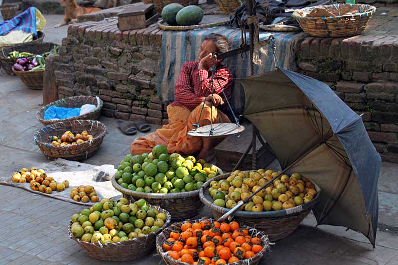 Fruit Seller Succumbs Sleeps in Durbar Square, Kathmandu, Nepal