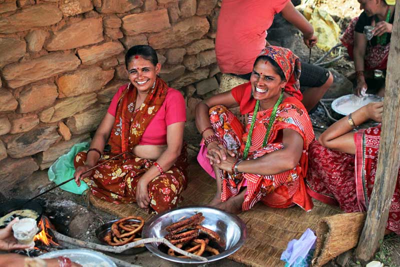 Preparing Selroti, Rice Rings Fried in Hot Oil, at a Puja in a Small Village in Nepal