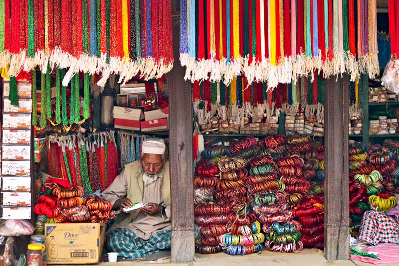 Muslim Vendor Sells Bracelets and Necklaces in Patan's Durbar Square, Nepal