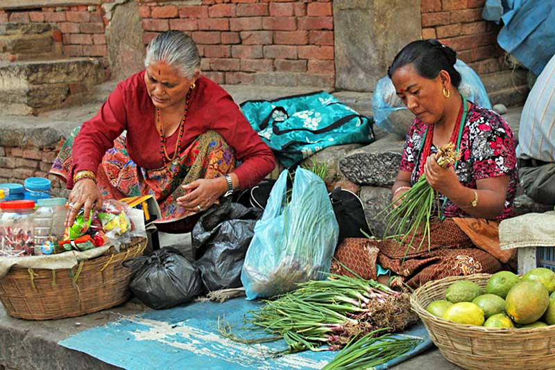 Women Prepare Produce for the Day's Customers in Durbar Square, Kathmandu, Nepal