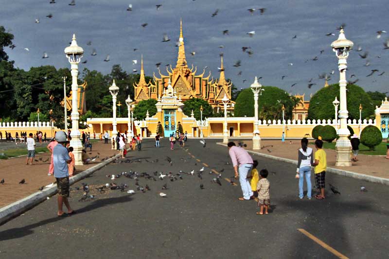 Visitors Feed Pigeons in Front of Royal Palace in Phnom Penh, Cambodia